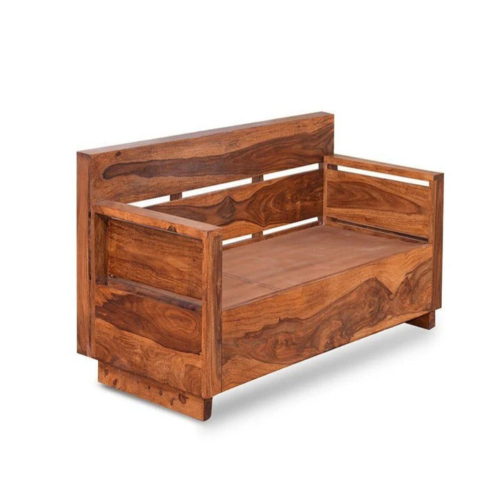 Honey wood single seater sofa chair with armrests, open sides, and carved back panel