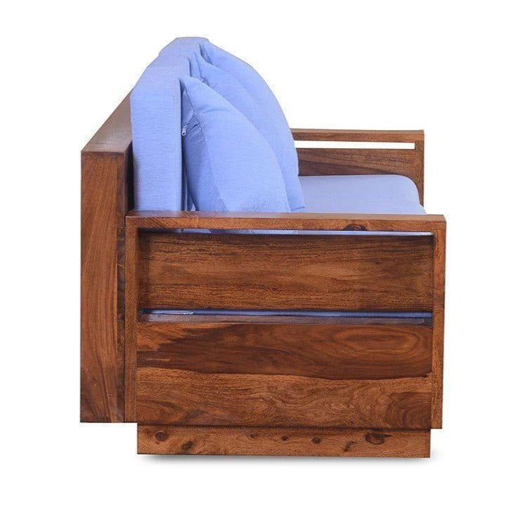 Honey wood single seater sofa chair with blue back pillow and seat cushion