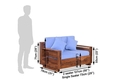 Single seater honey wood sofa chair with blue seat cushions and back pillows